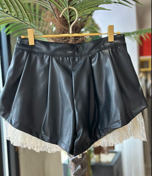 PLETED FAUX LEATHER SHORTS WITH RUFFLED LACE HEM