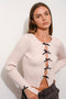 PEEKABOO BOW RIBBED KNIT TOP