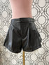PLETED FAUX LEATHER SHORTS WITH RUFFLED LACE HEM